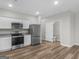 Modern kitchen with stainless steel appliances and granite countertops at 3135 Journal Ct, Decatur, GA 30035