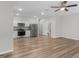 Kitchen and living area with stainless steel appliances and ceiling fan at 3135 Journal Ct, Decatur, GA 30035