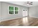 Spacious living room with a large window and patio access at 3135 Journal Ct, Decatur, GA 30035