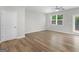 Bright living room with ceiling fan, window, and access to outdoor patio at 3135 Journal Ct, Decatur, GA 30035