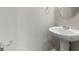 Powder room featuring pedestal sink, mirror and chrome fixtures at 3135 Journal Ct, Decatur, GA 30035