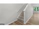 Inviting staircase with carpeted steps and hardwood floors at 3135 Journal Ct, Decatur, GA 30035