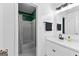 Bathroom boasts a modern vanity and a tub and shower combo with white tile at 135 Cherokee Pl, Fayetteville, GA 30215