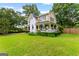 Lovely two-story house with a well-maintained yard and white picket fence at 135 Cherokee Pl, Fayetteville, GA 30215