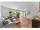 Spacious living area with comfortable seating, staircase, and natural light at 135 Cherokee Pl, Fayetteville, GA 30215