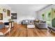 Bright and airy living room with a large sectional sofa and stylish decor at 135 Cherokee Pl, Fayetteville, GA 30215