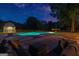 Backyard featuring a pristine pool, comfortable lounge seating, and a charming pool house, perfect for outdoor enjoyment at 135 Cherokee Pl, Fayetteville, GA 30215