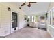 Cozy sunroom with brick floors, white shiplap walls, and multiple windows at 135 Cherokee Pl, Fayetteville, GA 30215