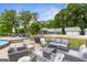 Backyard patio with outdoor furniture and an above-ground pool, ideal for relaxing and entertaining guests at 4002 Joshua Ln, Douglasville, GA 30135