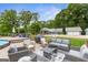 Backyard patio with outdoor furniture and an above-ground pool, ideal for relaxing and entertaining guests at 4002 Joshua Ln, Douglasville, GA 30135