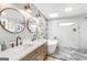 Luxurious bathroom featuring a soaking tub, walk-in shower, and double sink vanity at 4002 Joshua Ln, Douglasville, GA 30135
