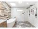 Stunning bathroom with white subway tiles, a soaking tub, and modern fixtures at 4002 Joshua Ln, Douglasville, GA 30135