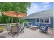 Outdoor deck with ample seating and an umbrella, perfect for entertaining or relaxing outdoors at 4002 Joshua Ln, Douglasville, GA 30135