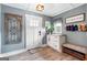 Inviting entryway with a charming bench and storage, decorated with a 'Home Sweet Home' sign at 4002 Joshua Ln, Douglasville, GA 30135