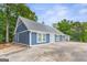 Charming home boasts a modern design with gray roof and a spacious yard at 4002 Joshua Ln, Douglasville, GA 30135