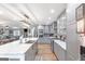 Spacious kitchen boasts marble counters, stainless appliances, and modern gray cabinets at 4002 Joshua Ln, Douglasville, GA 30135