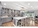 Spacious kitchen featuring a large island, stainless steel appliances, and modern gray cabinets at 4002 Joshua Ln, Douglasville, GA 30135