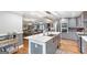 Kitchen with marble counters, stainless appliances, and open layout to dining and living area at 4002 Joshua Ln, Douglasville, GA 30135