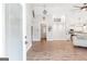 Open-concept living room with soaring ceilings, modern lighting, and seamless access to other rooms at 4002 Joshua Ln, Douglasville, GA 30135