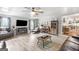 Spacious living room featuring modern furniture, a flat-screen TV, and wood-style flooring at 4002 Joshua Ln, Douglasville, GA 30135