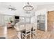 Well-lit, open-concept living room and kitchen area with luxury finishes and lots of natural light at 4002 Joshua Ln, Douglasville, GA 30135