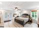 Main bedroom featuring a ceiling fan, wood floors, and access to backyard at 4002 Joshua Ln, Douglasville, GA 30135