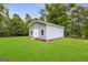 Exterior of a shed on green lawn and surrounded by mature trees at 4002 Joshua Ln, Douglasville, GA 30135