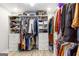 Organized walk-in closet with custom shelving, drawers, hanging racks, and plenty of storage space for clothes and accessories at 4002 Joshua Ln, Douglasville, GA 30135