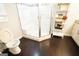 View of the bathroom featuring a large shower with a built in seat and wood floors at 3010 Waters Rd Sw, Atlanta, GA 30354