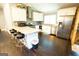 Modern kitchen with white cabinets, stainless steel appliances, and eat-in island at 3010 Waters Rd Sw, Atlanta, GA 30354