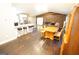 Bright living area with open floor plan, brick fireplace, and kitchen with breakfast bar at 3010 Waters Rd Sw, Atlanta, GA 30354