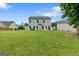 Large, open backyard offers plenty of space for entertaining or creating your dream outdoor oasis at 140 Canyons, Hampton, GA 30228