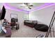 A stylish bedroom featuring LED lighting, a daybed, and a dedicated gaming setup at 140 Canyons, Hampton, GA 30228