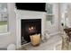 Close-up of the fireplace showcasing the elegant mantel and cozy ambiance at 140 Canyons, Hampton, GA 30228