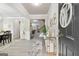 Elegant foyer featuring modern decor, a statement rug, and bright, neutral walls at 140 Canyons, Hampton, GA 30228