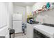 Functional laundry room featuring modern washer/dryer and ample storage space at 140 Canyons, Hampton, GA 30228