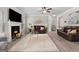 Inviting living room with fireplace, plush seating, and neutral decor creating a warm atmosphere at 140 Canyons, Hampton, GA 30228