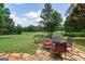 Enjoy outdoor dining on the backyard patio with a golf course backdrop at 410 Golf View Dr, Peachtree City, GA 30269