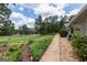 Well-maintained backyard featuring lush landscaping and a scenic golf course view at 410 Golf View Dr, Peachtree City, GA 30269