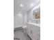Bathroom features a shower/tub, white vanity with marble countertop, and a large mirror at 410 Golf View Dr, Peachtree City, GA 30269