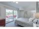 Calm bedroom with a luxurious bed, patio access, and ample built-in storage for a peaceful living space at 410 Golf View Dr, Peachtree City, GA 30269