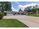 Charming single-story home with a well-manicured lawn, spacious driveway, and inviting front entrance at 410 Golf View Dr, Peachtree City, GA 30269