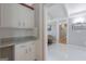 Bright hallway with white cabinets and countertops at 410 Golf View Dr, Peachtree City, GA 30269