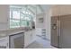 Modern kitchen featuring stainless steel appliances, granite countertops, and bright natural light at 410 Golf View Dr, Peachtree City, GA 30269