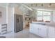 Open kitchen design with stainless steel appliances and granite counters, perfect for entertaining at 410 Golf View Dr, Peachtree City, GA 30269