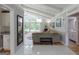 Bright living room with vaulted ceilings, ceiling fan, and large windows overlooking the backyard at 410 Golf View Dr, Peachtree City, GA 30269