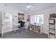 Cozy office space with natural light, ample desk space, and built-in shelving for storage and organization at 410 Golf View Dr, Peachtree City, GA 30269