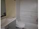 Bathroom featuring a new vanity and shower-tub combo at 990 Hickory Bend Rd, Atlanta, GA 30349