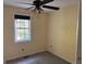 Bedroom featuring carpeted floors and a single window at 990 Hickory Bend Rd, Atlanta, GA 30349