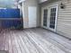 A wood deck that exits into a door and a set of french doors on the back of the house at 990 Hickory Bend Rd, Atlanta, GA 30349